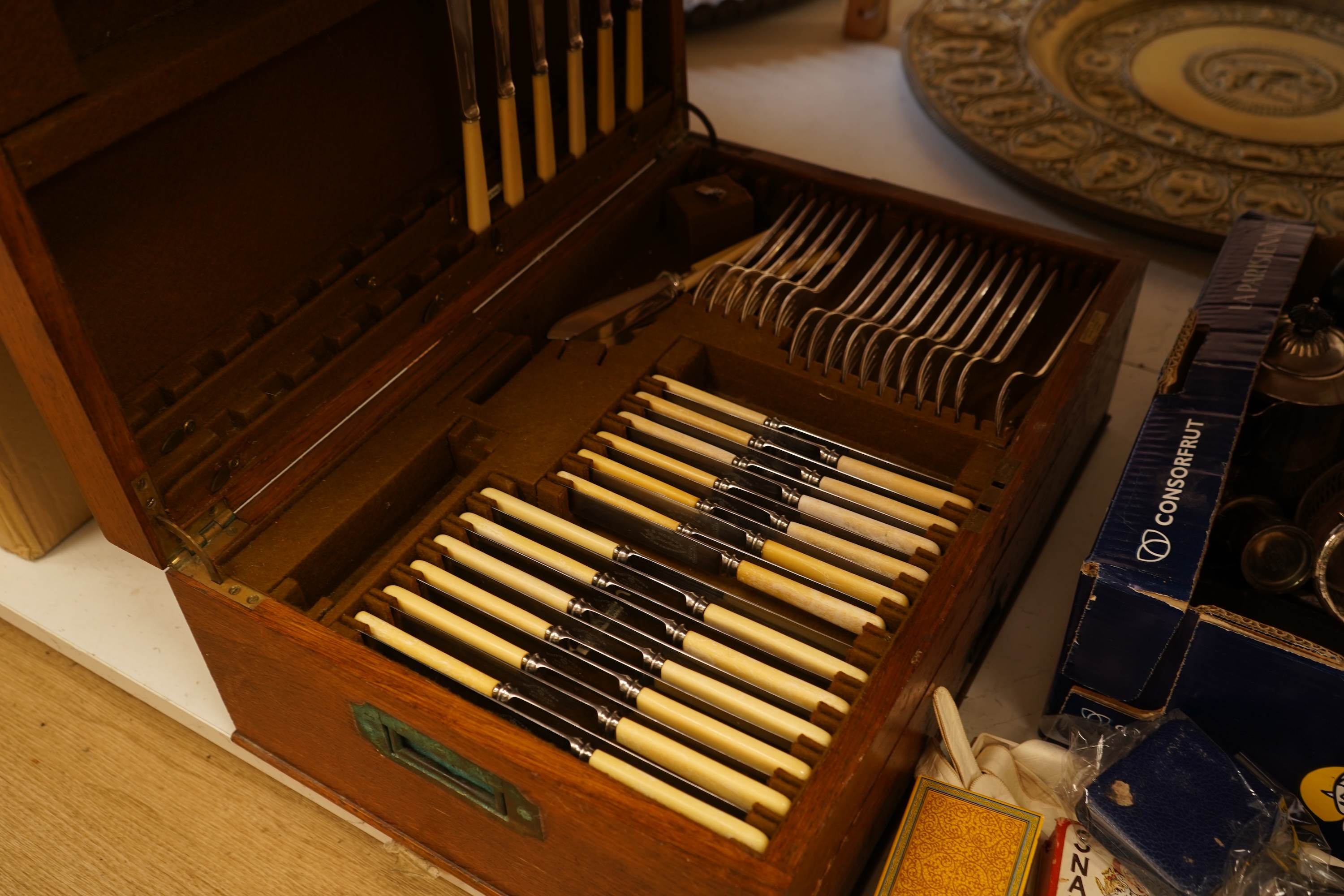 An early 20th century Mappin & Webb canteen and assorted plate other cutlery a boxed set of black enamelled studs and cufflinks etc